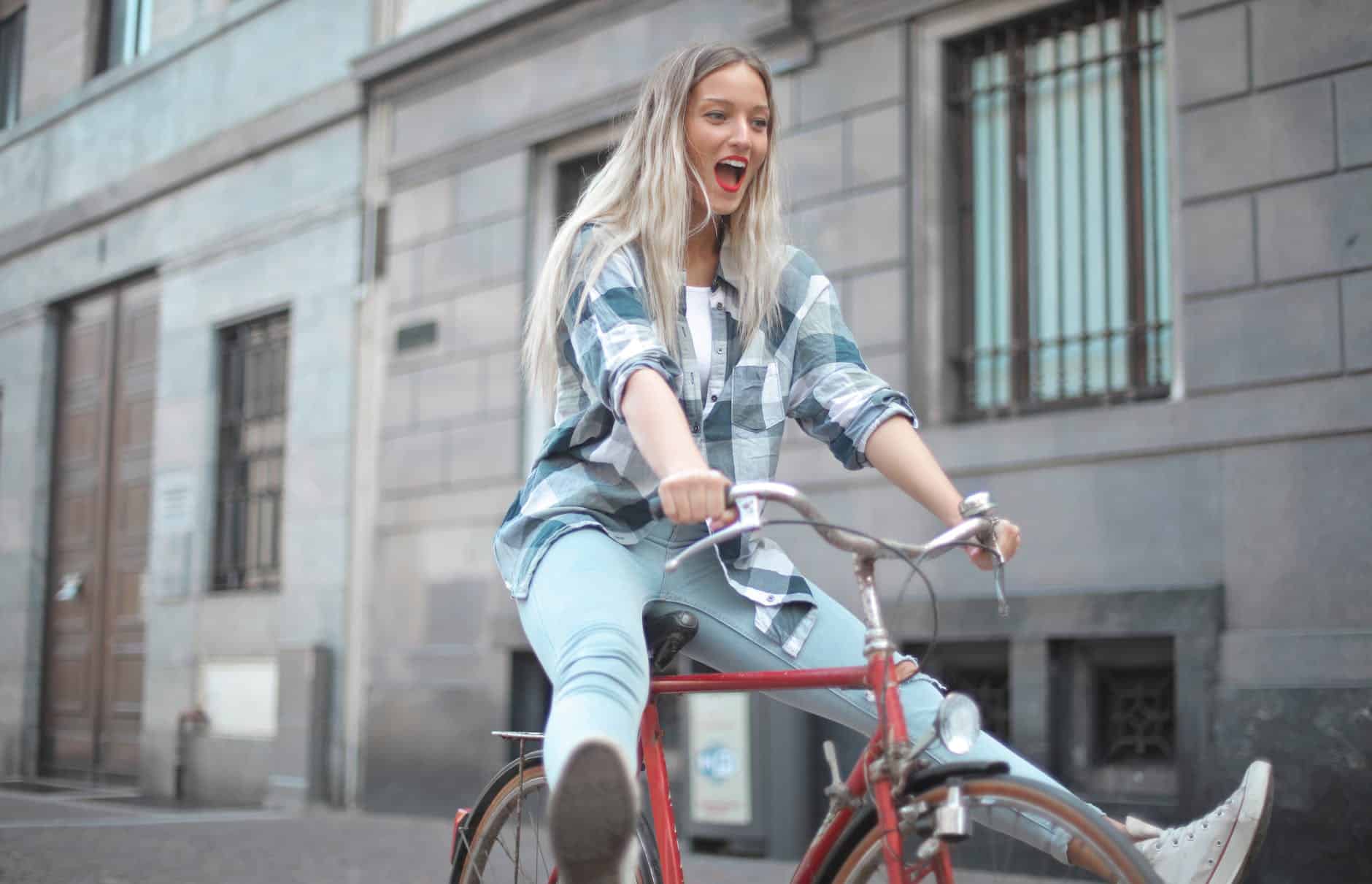 photo of woman riding bicycle