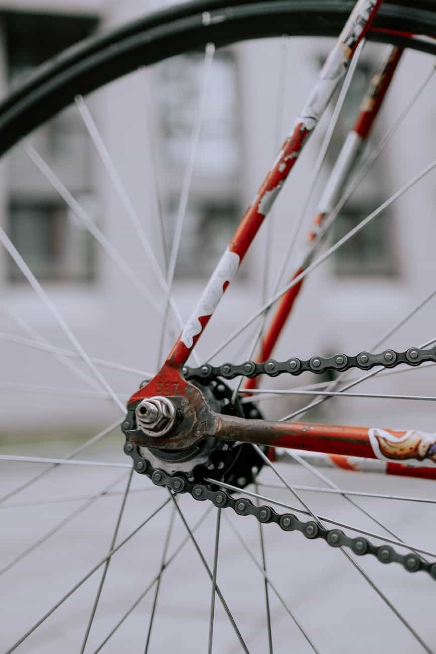 red bicycle wheel with chain