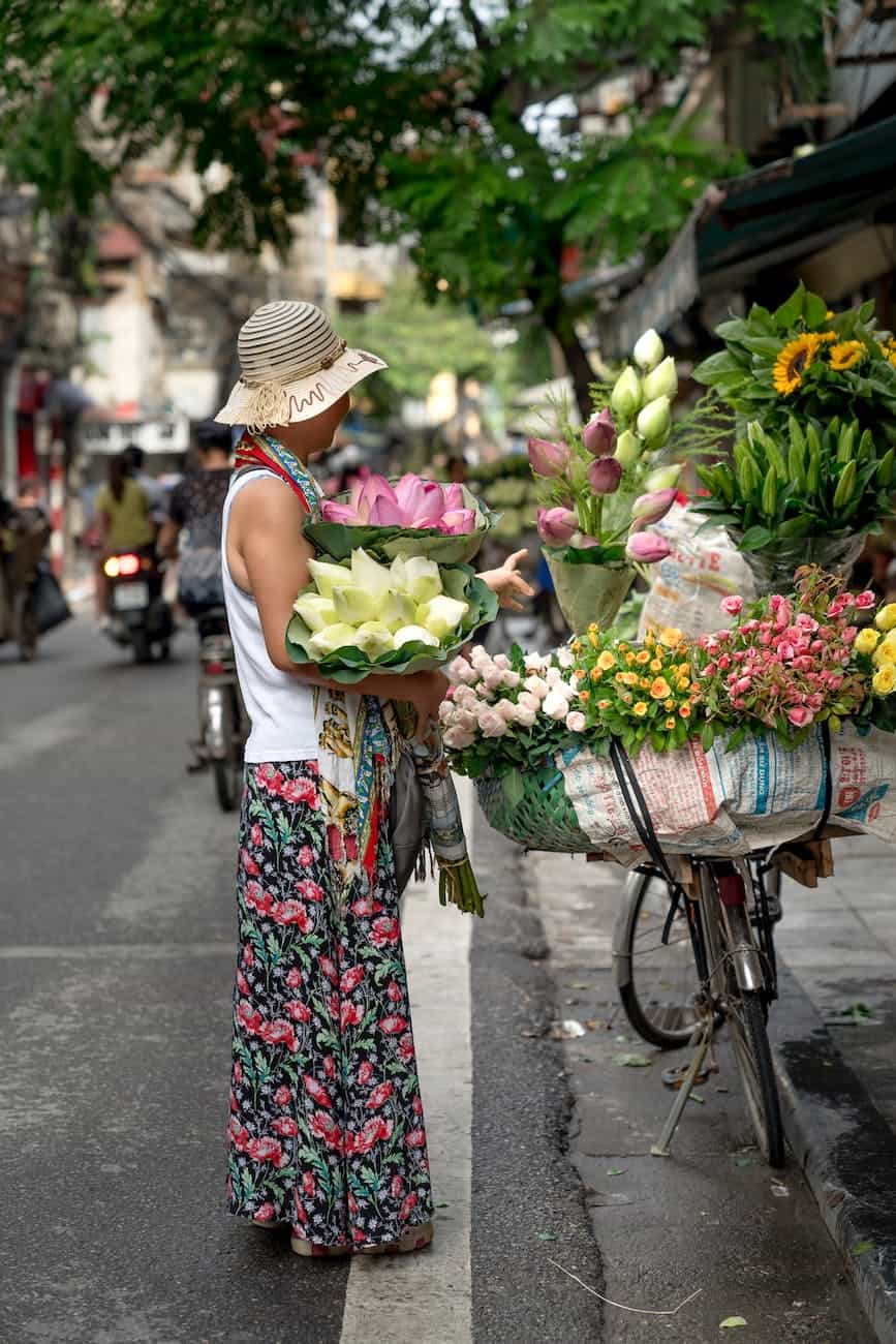 woman holding bouquet of flowers