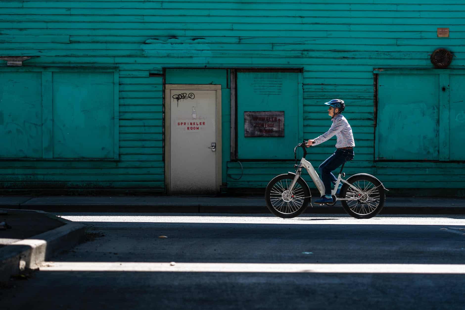 a man riding electric bicycle on the street