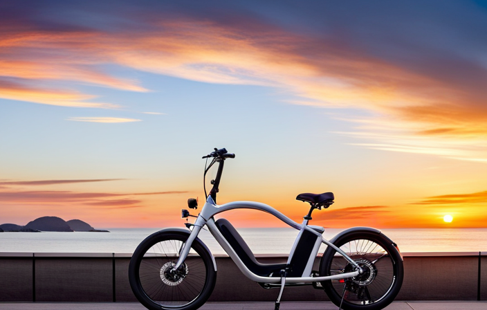 An image showcasing an electric bike cruising effortlessly along a scenic coastal road, with the sun setting on the horizon