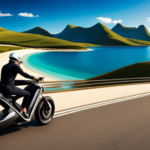 An image showcasing a sleek electric bike gliding along a breathtaking coastal road, with a panoramic view of rolling hills and a distant mountain range, emphasizing the limitless possibilities of its range on a single charge