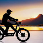 An image capturing the silhouette of a rider on an electric bike, cruising along a winding road that stretches into the horizon