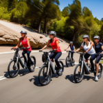 An image featuring a diverse group of people riding sleek, high-performance electric bikes amidst a stunning backdrop of winding mountain trails, showcasing the versatility, power, and enjoyment of electric biking